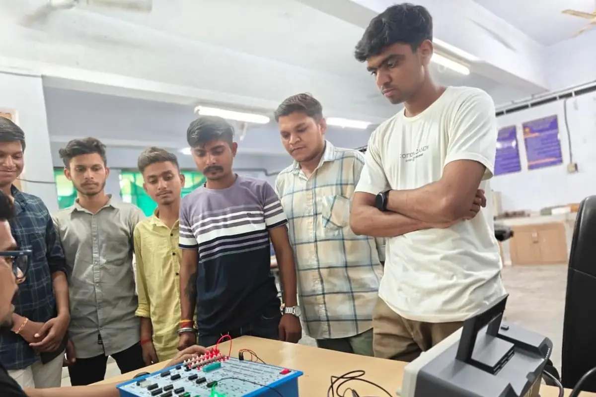 Faculty demonstrating logic gate operation on the digital IC trainer