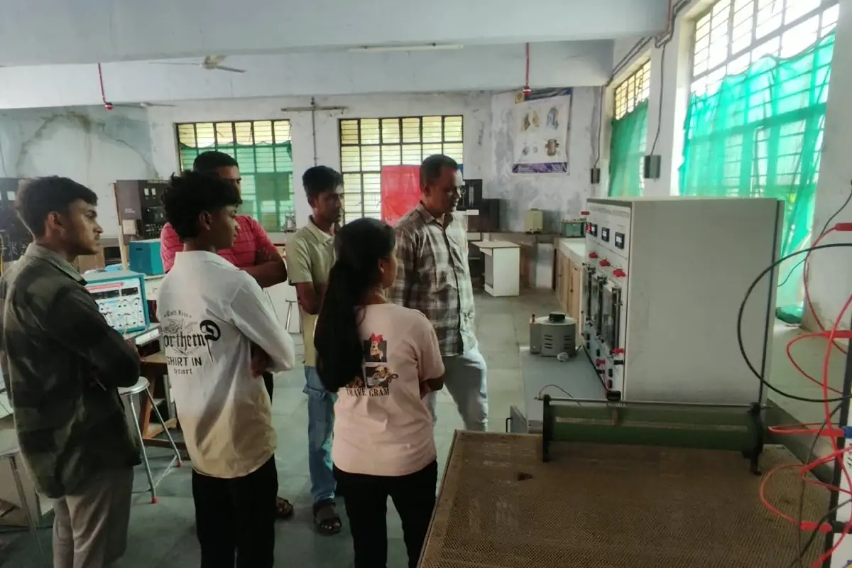 Students at the single-phase three-section radial feeder protection trainer