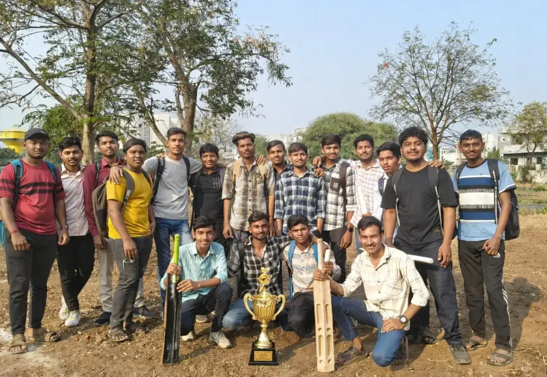 Electrical students celebrating with their institute cricket trophy